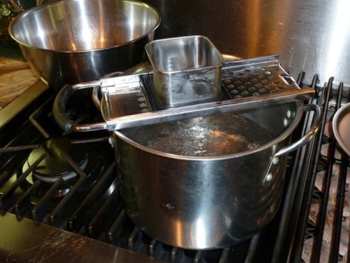 Place spaetzle maker over salted, rapidly boiling water