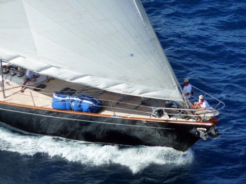 Cleaving through Water — Action photography combined with reflection (hull) and negative space (sail)