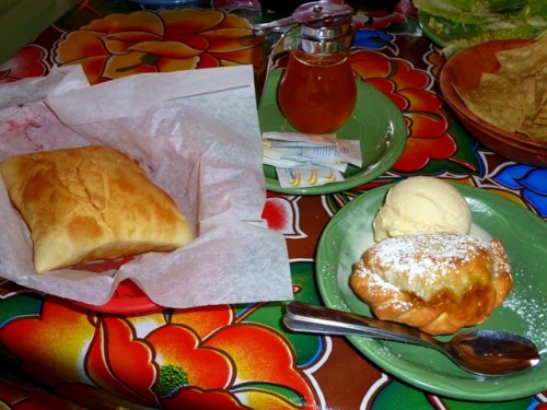 Sopapilla with honey on the left; Apricot Empanada a la Mode to the right