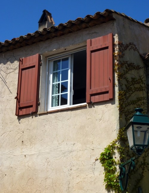 The Shuttered Window — Rule of Thirds, negative space (wall), framing (roof line and sky; shaded vines and street lamp)
