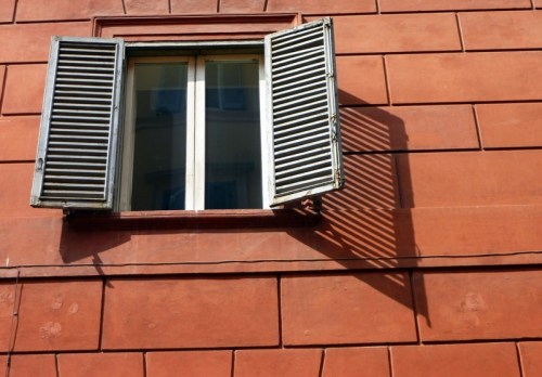 The Window — Rule of Thirds; Negative space framing; Interesting shutter shadow