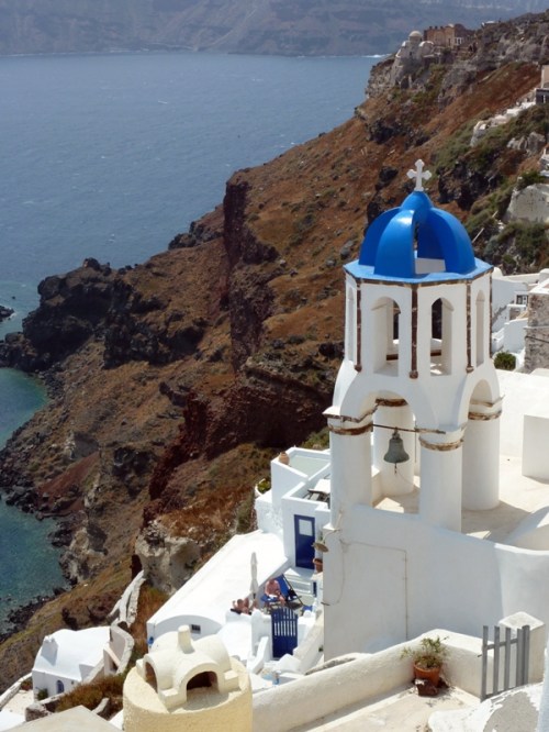 Caldera Overlook in Santorini — Rule of Thirds, splash of blue color framed against a dramatic backdrop