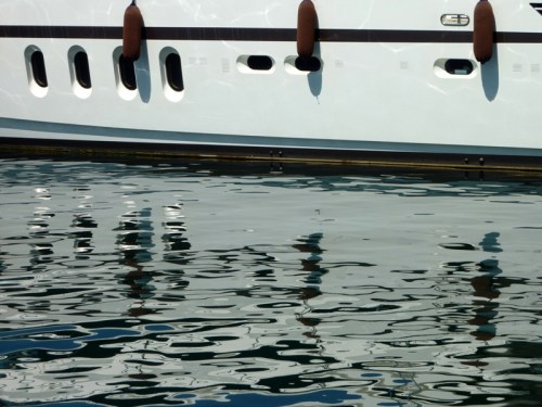Reflections in St. Tropez — Rule of Thirds (hull/waterline) and gentle, wavy water reflection