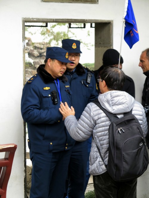 Deputy Fife interrogates our tour guide Mao "Jim" Chen