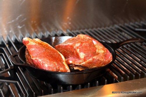 Place halves into a very hot skillet fat side down