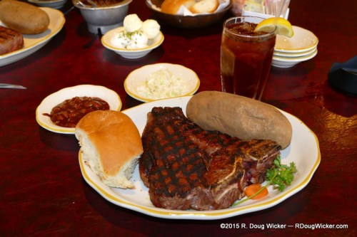 "The Cowgirl" 1½-pound T-bone, potato, fresh roll, spicy ranch beans, and pineapple coleslaw