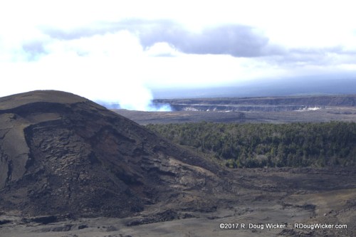 Kilauea Iki Crater — Kilauea Caldera smoking in the background